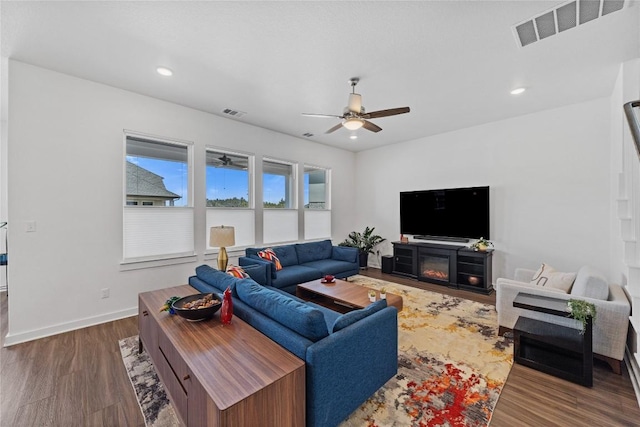 1209 Willie Ranch Way, Leander, TX 78641 - living area with a ceiling fan, wood finished floors, recessed lighting, and baseboards