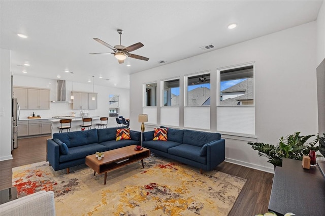 1209 Willie Ranch Way, Leander, TX 78641 - living area featuring ceiling fan, dark wood-style flooring, baseboards, and recessed lighting