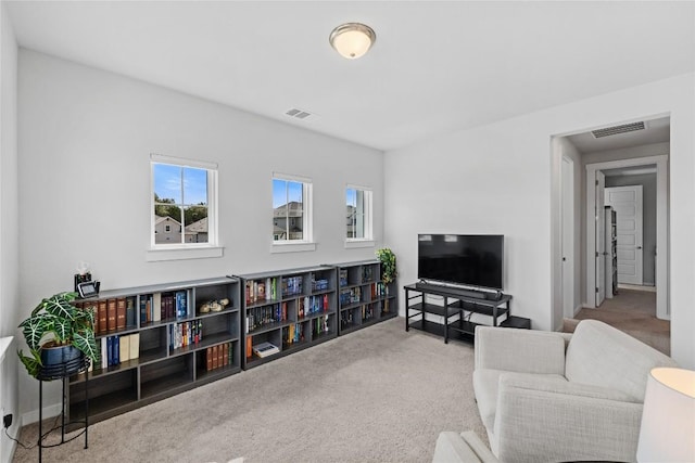 1209 Willie Ranch Way, Leander, TX 78641 - living area featuring healthy amount of natural light and carpet flooring