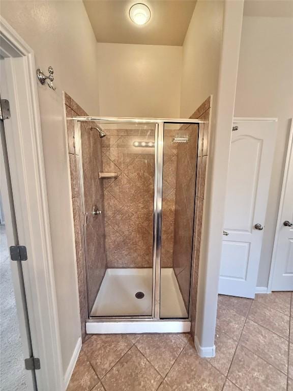 608 Pebblestone Walk Dr, Cedar Park, TX 78613 - bathroom with tile patterned floors and a stall shower