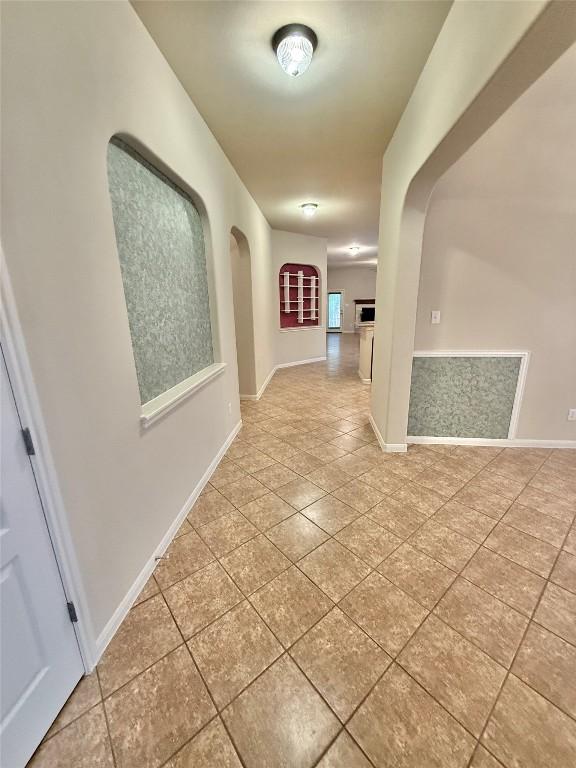 608 Pebblestone Walk Dr, Cedar Park, TX 78613 - hallway with tile patterned floors and arched walkways
