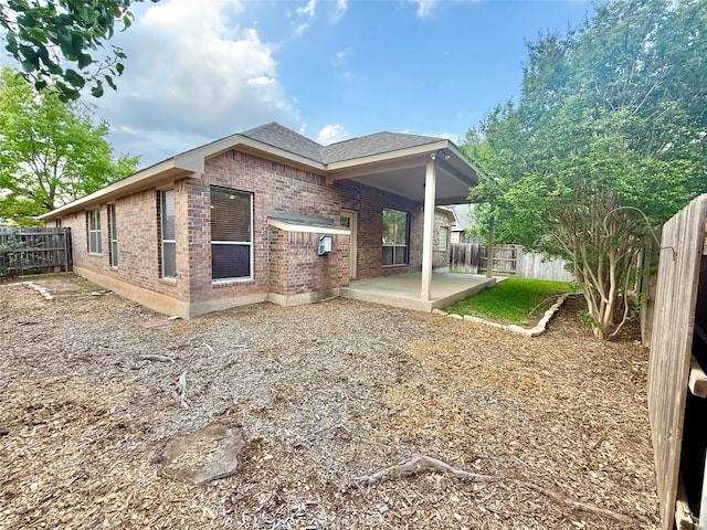 608 Pebblestone Walk Dr, Cedar Park, TX 78613 - rear view of house featuring a patio area, brick siding, a fenced backyard, and roof with shingles