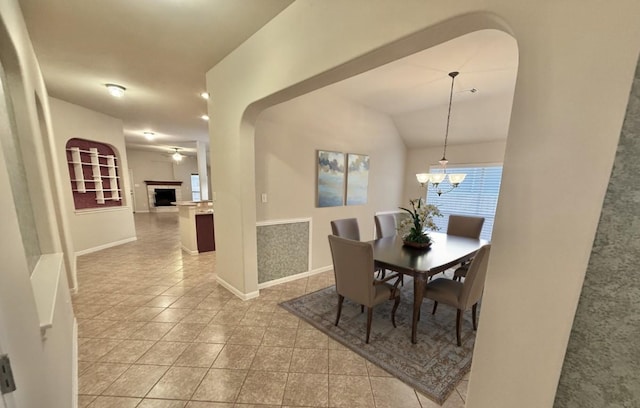 608 Pebblestone Walk Dr, Cedar Park, TX 78613 - dining area with light tile patterned floors, a chandelier, and arched walkways