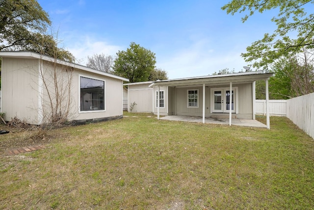 10418 Doc Holliday Trl, Austin, TX 78753 - back of house with french doors, a patio area, and a fenced backyard