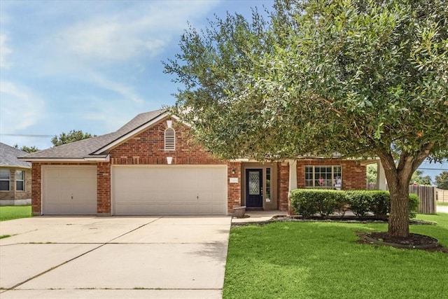 1606 Belvedere Pl, Round Rock, TX 78665 - view of front of home featuring driveway, an attached garage, brick siding, and roof with shingles