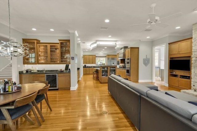 3208 Rain Dance Cv, Austin, TX 78746 - living room featuring wine cooler, light wood-style floors, recessed lighting, wet bar, and a ceiling fan