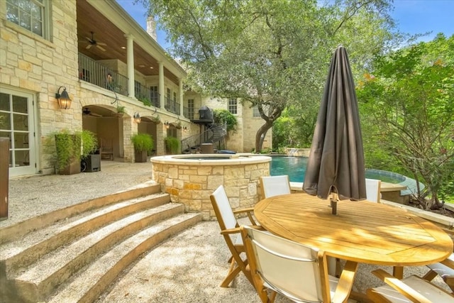 3208 Rain Dance Cv, Austin, TX 78746 - patio / terrace with ceiling fan, a patio, outdoor dining area, and a pool with connected hot tub