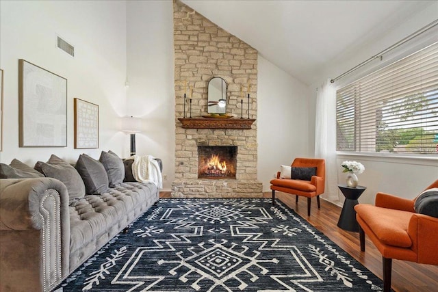 8204 Seminary Ridge Dr, Austin, TX 78745 - living area featuring wood finished floors, a stone fireplace, and high vaulted ceiling