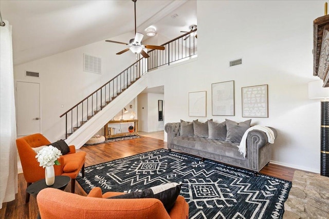 8204 Seminary Ridge Dr, Austin, TX 78745 - living room featuring stairs, ceiling fan, high vaulted ceiling, and wood finished floors