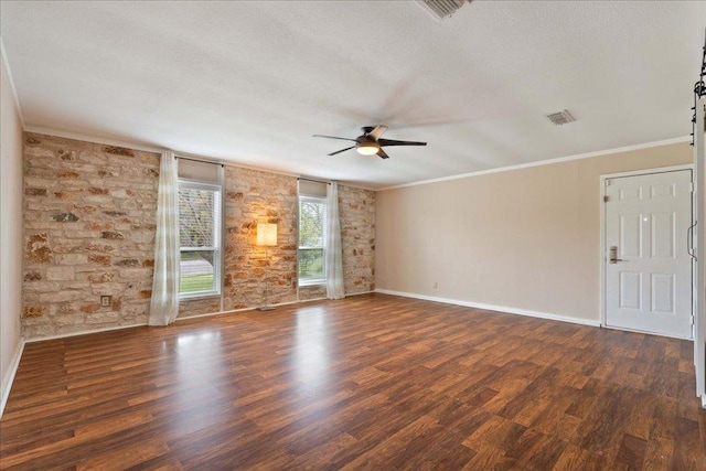 8204 Seminary Ridge Dr, Austin, TX 78745 - spare room featuring a ceiling fan, crown molding, wood finished floors, and a textured ceiling
