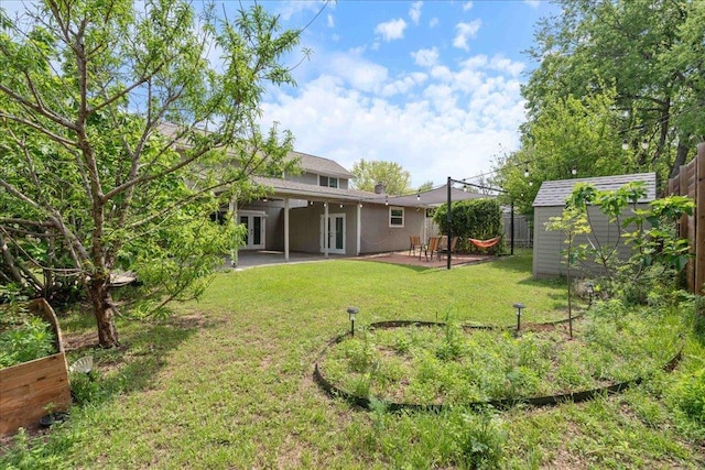 8204 Seminary Ridge Dr, Austin, TX 78745 - view of yard with french doors, a patio area, and a shed