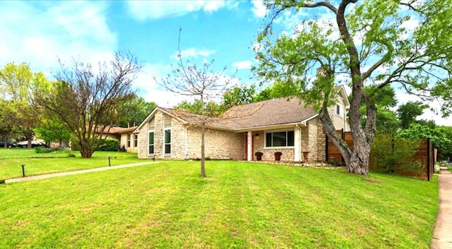 8204 Seminary Ridge Dr, Austin, TX 78745 - ranch-style home with stone siding and a front yard