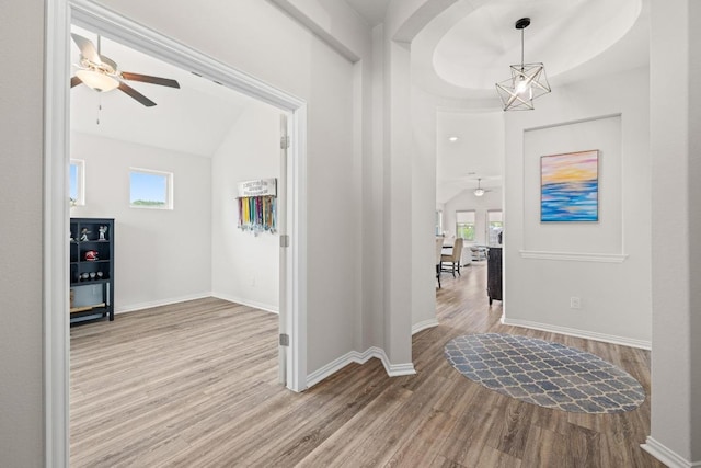 608 Roaming Dr, Hutto, TX 78634 - entryway with ceiling fan, wood finished floors, healthy amount of natural light, and vaulted ceiling