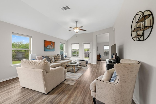 608 Roaming Dr, Hutto, TX 78634 - living area featuring plenty of natural light, wood finished floors, ceiling fan, and lofted ceiling