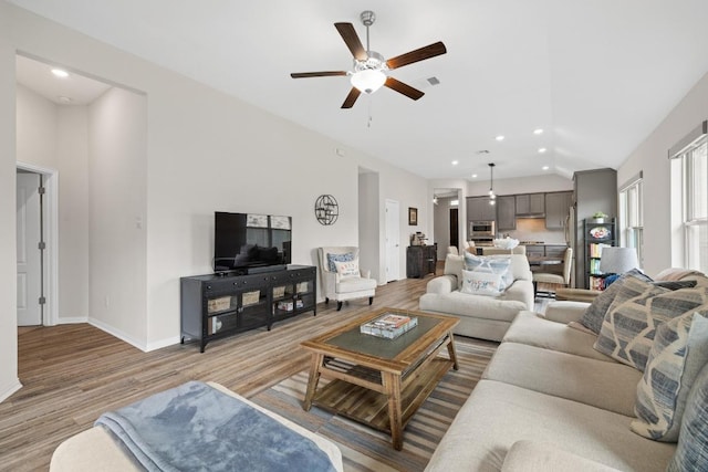 608 Roaming Dr, Hutto, TX 78634 - living area featuring a ceiling fan, light wood-style floors, lofted ceiling, and recessed lighting