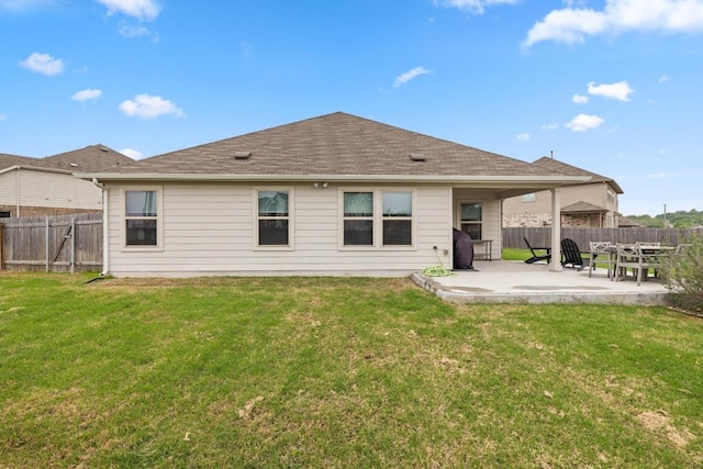 608 Roaming Dr, Hutto, TX 78634 - rear view of house with a patio area, a fenced backyard, and a shingled roof