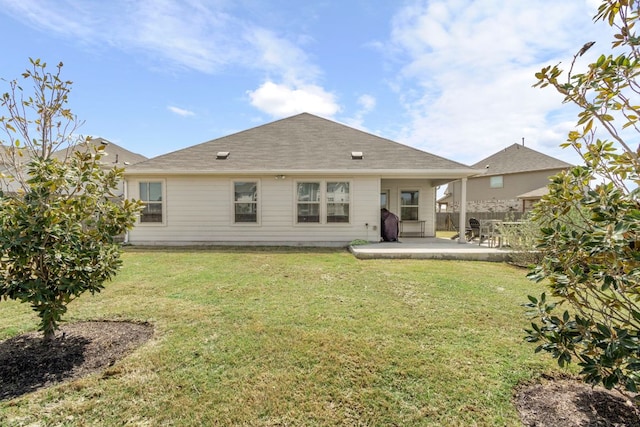 608 Roaming Dr, Hutto, TX 78634 - back of house featuring a patio area and a lawn
