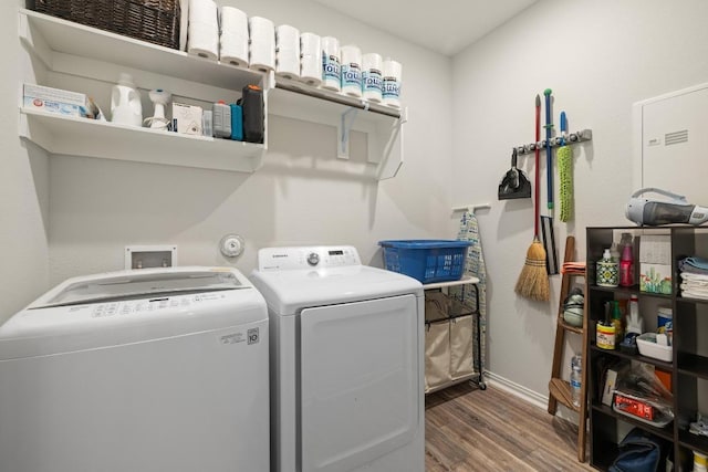 608 Roaming Dr, Hutto, TX 78634 - laundry area featuring washer and clothes dryer and wood finished floors