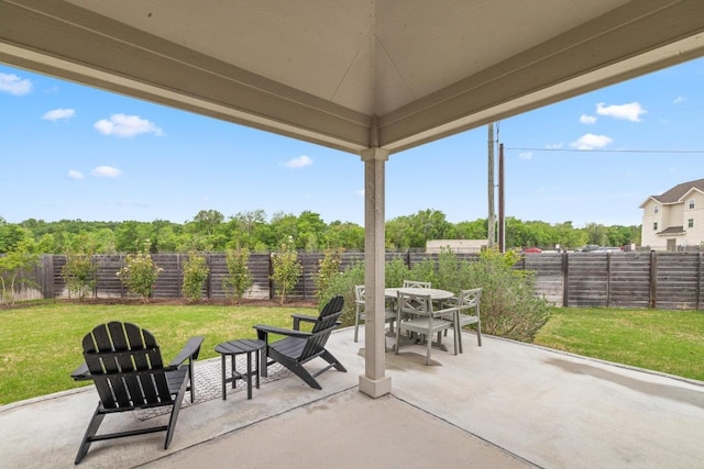 608 Roaming Dr, Hutto, TX 78634 - fenced backyard with outdoor dining space and a patio