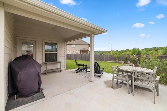 608 Roaming Dr, Hutto, TX 78634 - fenced backyard with outdoor dining space, a patio, and area for grilling