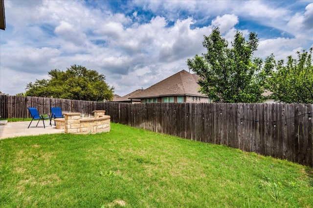 109 Pine Is, Leander, TX 78641 - fenced backyard with a patio area