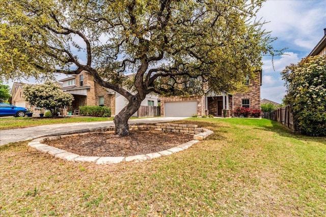 109 Pine Is, Leander, TX 78641 - view of front of house featuring driveway, stone siding, and an attached garage