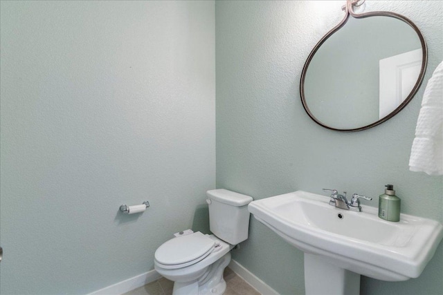 109 Pine Is, Leander, TX 78641 - half bath with toilet and tile patterned floors