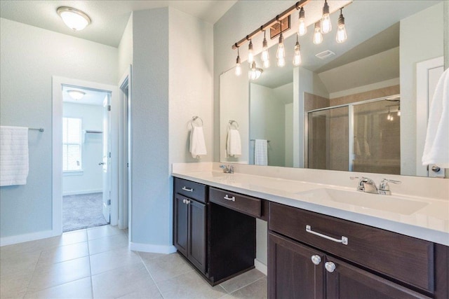 109 Pine Is, Leander, TX 78641 - full bathroom with a stall shower, double vanity, and tile patterned floors