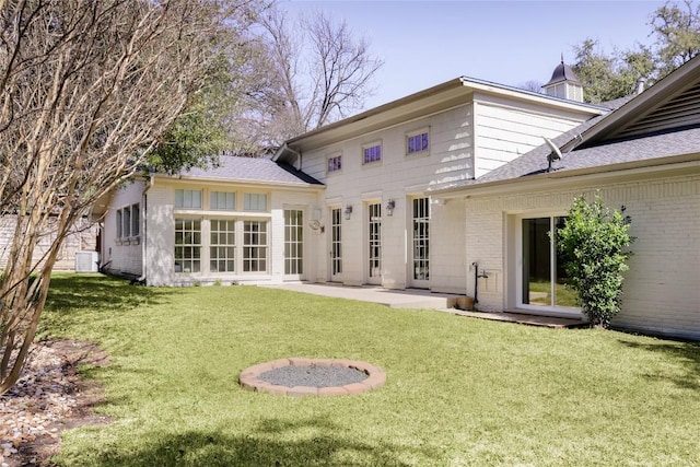 1904 Meadowbrook Dr, Austin, TX 78703 - rear view of house featuring a yard, a shingled roof, a patio, and cooling unit