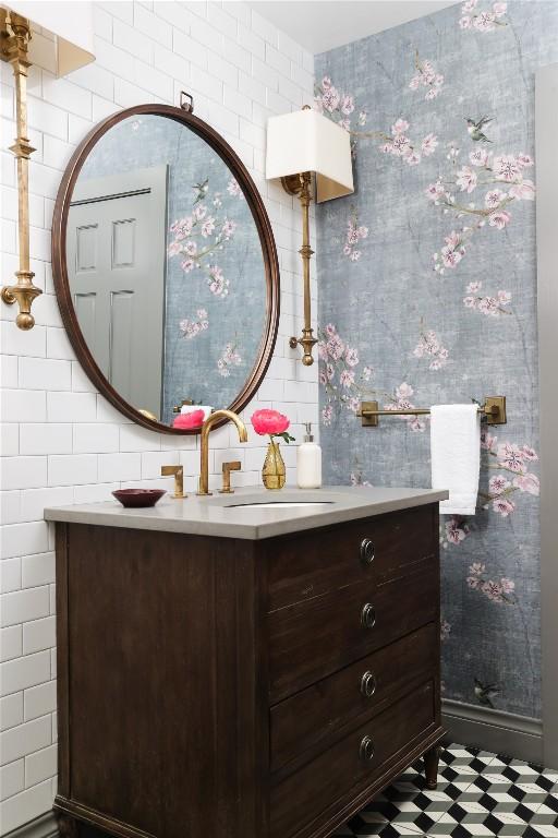 1904 Meadowbrook Dr, Austin, TX 78703 - bathroom with vanity, wallpapered walls, tile walls, and tile patterned floors