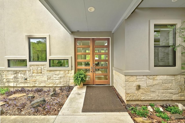 9206 Chisholm Ln, Austin, TX 78748 - doorway to property with stone siding, french doors, and stucco siding