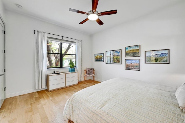 9206 Chisholm Ln, Austin, TX 78748 - bedroom with light wood finished floors, baseboards, and ceiling fan