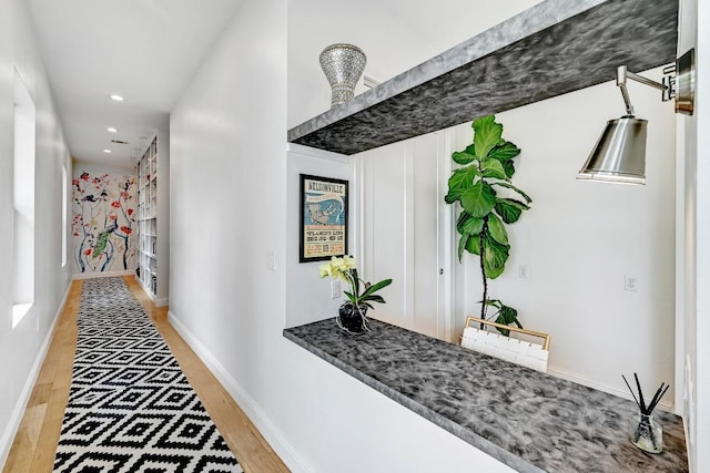 9206 Chisholm Ln, Austin, TX 78748 - hall featuring light wood-type flooring, recessed lighting, and baseboards