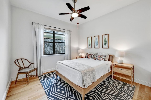 9206 Chisholm Ln, Austin, TX 78748 - bedroom with light wood finished floors, baseboards, and a ceiling fan