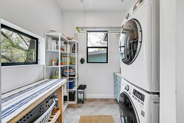 9206 Chisholm Ln, Austin, TX 78748 - laundry area featuring stacked washer / dryer and baseboards