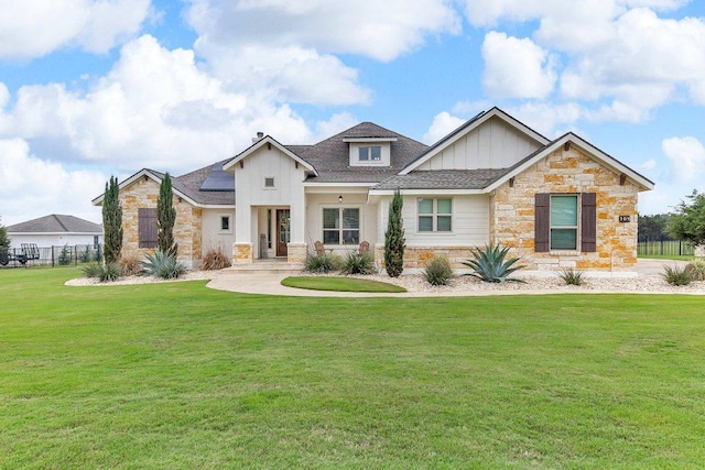 109 Spice Bush Spgs, Leander, TX 78641 - view of front of home featuring board and batten siding, stone siding, and a shingled roof