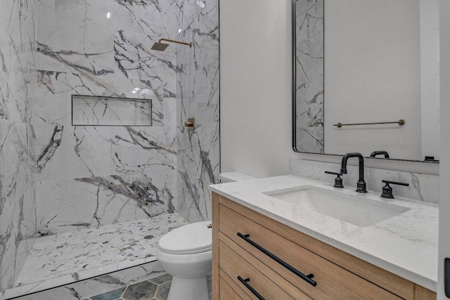 109 Spice Bush Spgs, Leander, TX 78641 - bathroom featuring vanity, toilet, a marble finish shower, and marble look tiles