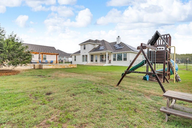 109 Spice Bush Spgs, Leander, TX 78641 - back of house with a playground