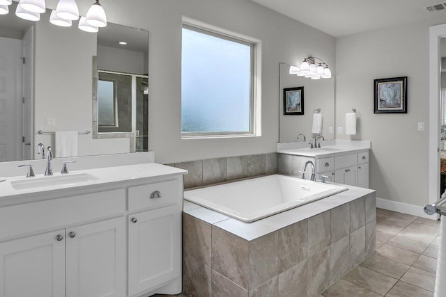 109 Spice Bush Spgs, Leander, TX 78641 - full bath with a bath, vanity, tile patterned flooring, and an enclosed shower