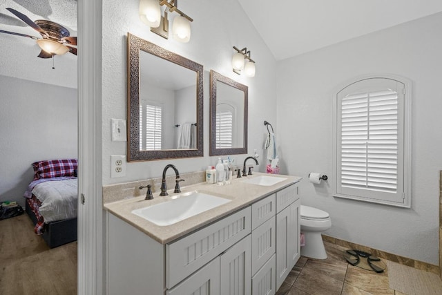 8410 Glen Canyon Dr, Round Rock, TX 78681 - ensuite bathroom with ceiling fan, double vanity, and vaulted ceiling