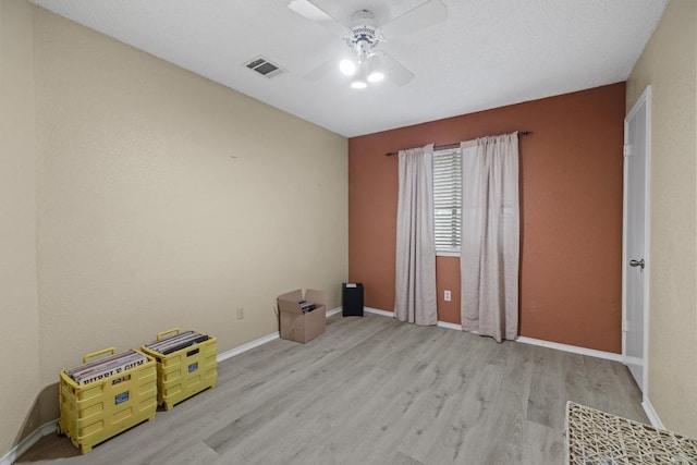 8410 Glen Canyon Dr, Round Rock, TX 78681 - spare room featuring wood finished floors and ceiling fan