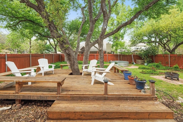 8410 Glen Canyon Dr, Round Rock, TX 78681 - wooden terrace featuring a fire pit and a fenced backyard