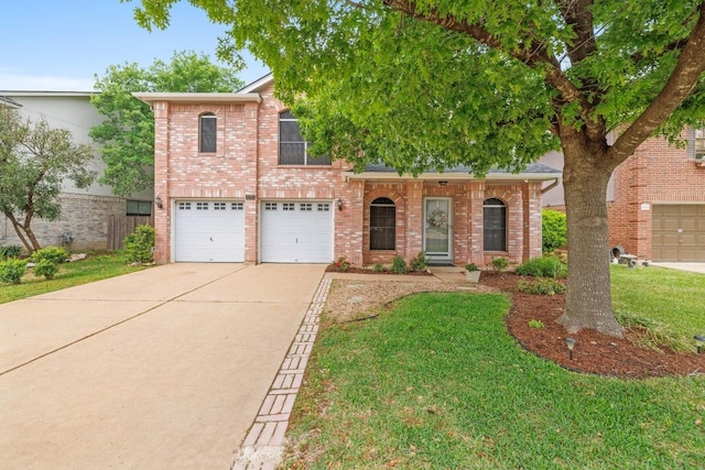 8410 Glen Canyon Dr, Round Rock, TX 78681 - traditional-style house with an attached garage, concrete driveway, and brick siding
