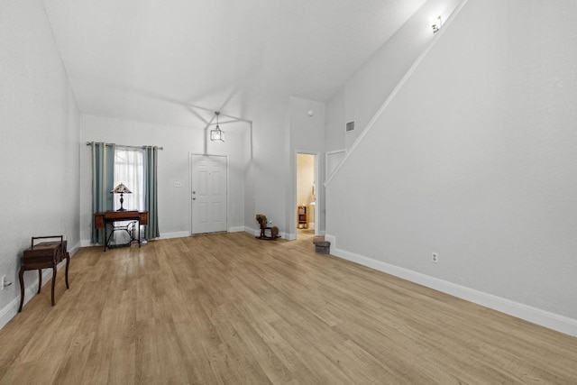 8410 Glen Canyon Dr, Round Rock, TX 78681 - unfurnished living room with light wood-style flooring and baseboards