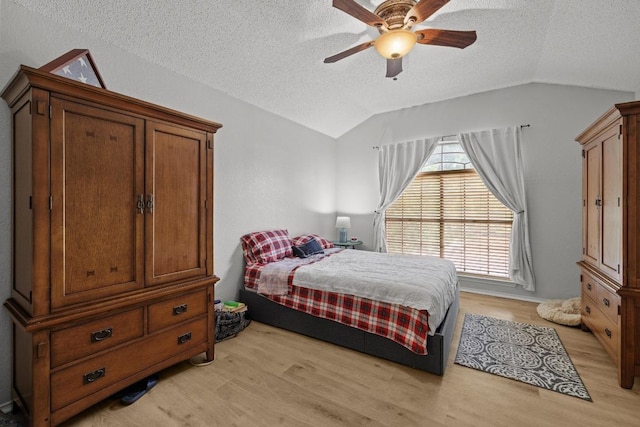 8410 Glen Canyon Dr, Round Rock, TX 78681 - bedroom featuring lofted ceiling, light wood finished floors, a textured ceiling, and a ceiling fan