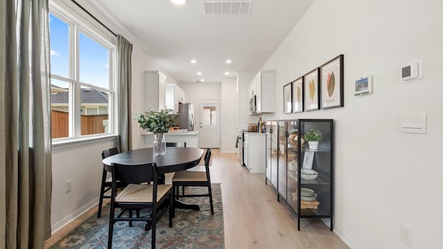 2620 Caleb Asher Loop, Round Rock, TX 78665 - dining area with light wood-style floors and recessed lighting