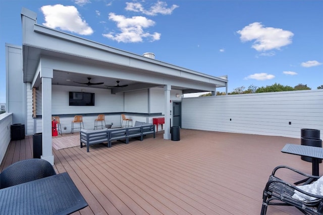 2220 Webberville Rd Unit 207, Austin, TX 78702 - wooden deck featuring a ceiling fan and exterior bar