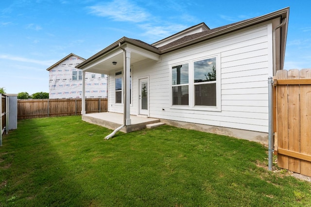 2201 Cento Walk Unit 70, Round Rock, TX 78664 - rear view of house featuring a patio