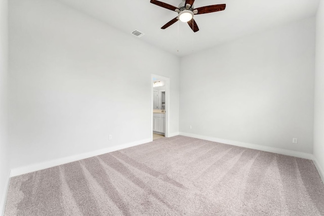 2201 Cento Walk Unit 70, Round Rock, TX 78664 - spare room with ceiling fan, light carpet, and baseboards