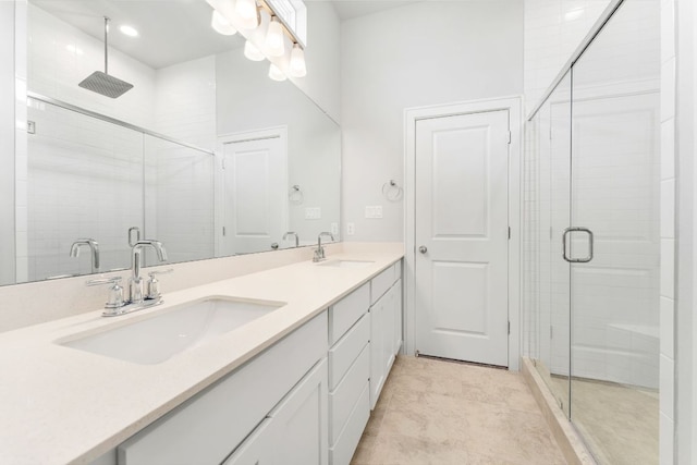 2201 Cento Walk Unit 70, Round Rock, TX 78664 - bathroom featuring a stall shower, double vanity, and recessed lighting